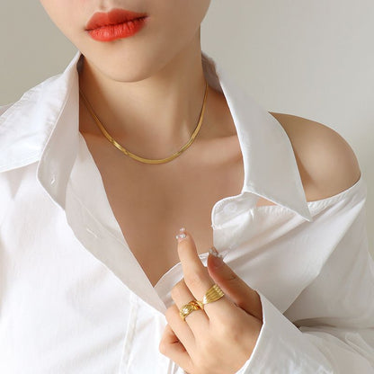 18k gold waterproof herringbone necklace on model