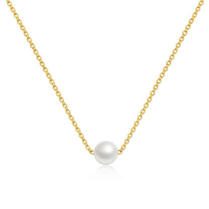 Gold necklace with a single pearl pendant on a white background